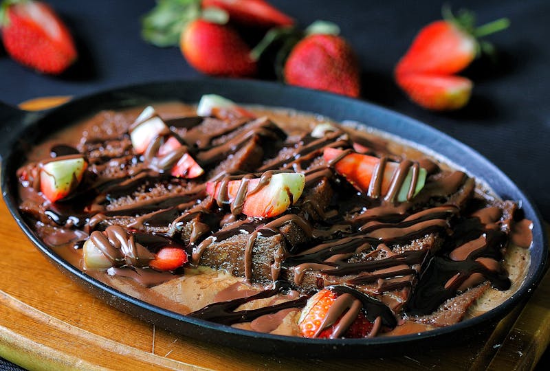 Nutella pizza dessert with fresh strawberries