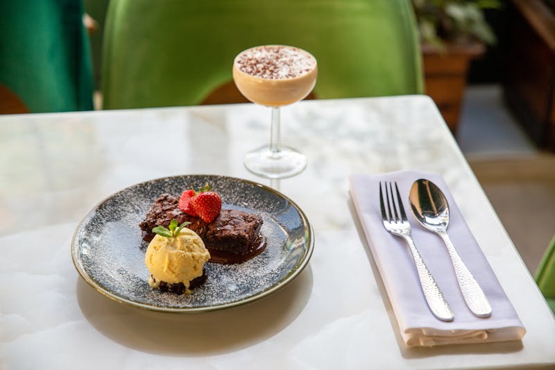 Mod Pizza chef crafting a handmade pizza in our Rockford kitchen